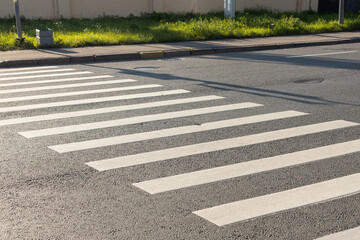 pedestrian crossing, white stripes on black asphalt, road markings zebra crossing, place to cross...