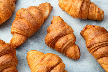 Group of sweet croissant . French morning breakfast . Top view