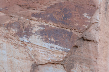 Detail of indigenous culture Petroglyphs etch in the walls along Potash Road in Moab Utah