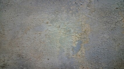 Aged and weathered white wall with multiple cracks and fractures, distressed surface texture background for design and architecture