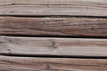 Wooden walkways on the coast of Spain. Wood texture, sand.