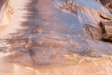 Detail of indigenous culture Petroglyphs etch in the walls along Potash Road in Moab Utah