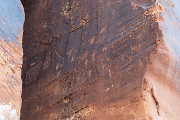 Detail of indigenous culture Petroglyphs etch in the walls along Potash Road in Moab Utah
