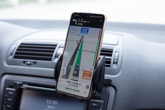 Beijing, China - October 6, 2024: A driver uses the Auder Map APP to navigate to his destination. Beidou Navigation Satellite System (BDS) is a global satellite navigation system developed by China.