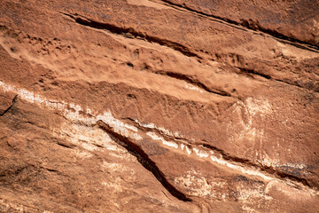 Detail of indigenous culture Petroglyphs etch in the walls along Potash Road in Moab Utah