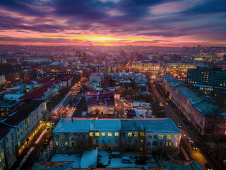 Fototapeta premium The evening panorama of Irkutsk city streets, with the colorful sunset and Russian architecture, in Russia. 
