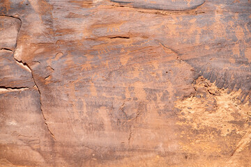 Detail of indigenous culture Petroglyphs etch in the walls along Potash Road in Moab Utah