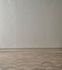 Grey textured wall background and parquet floor, vase of plant coffee table and chair concept, interior style.