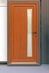 Closed wooden door with glass detail inside retro interior