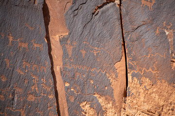 Detail of indigenous culture Petroglyphs etch in the walls along Potash Road in Moab Utah