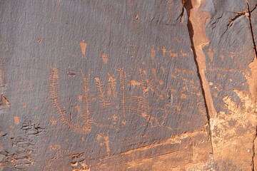 Detail of indigenous culture Petroglyphs etch in the walls along Potash Road in Moab Utah