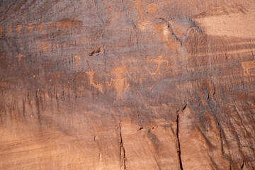 Detail of indigenous culture Petroglyphs etch in the walls along Potash Road in Moab Utah