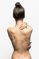 Back view of a woman with great skin. Pani, skin care. Isolated on white background.
