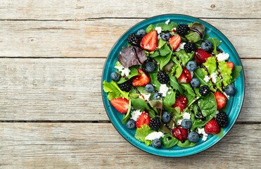 Berries salad (blueberry strawberry blackberry ) with cheese feta and balsamic sauce