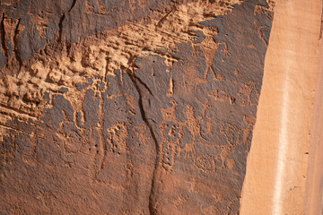 Detail of indigenous culture Petroglyphs etch in the walls along Potash Road in Moab Utah