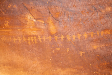 Detail of indigenous culture Petroglyphs etch in the walls along Potash Road in Moab Utah