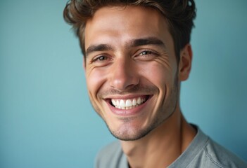 Obraz premium Young man with perfect healthy pearly white teeth smile. Health, teeth whitening, dental care, dentistry, stomatology concept