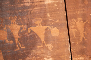 Detail of indigenous culture Petroglyphs etch in the walls along Potash Road in Moab Utah