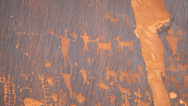 Detail of indigenous culture Petroglyphs etch in the walls along Potash Road in Moab Utah