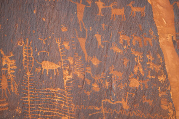 Detail of indigenous culture Petroglyphs etch in the walls along Potash Road in Moab Utah