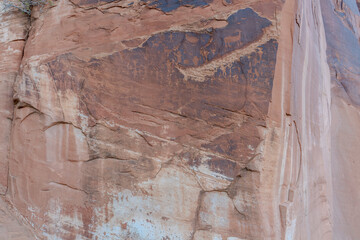 Detail of indigenous culture Petroglyphs etch in the walls along Potash Road in Moab Utah