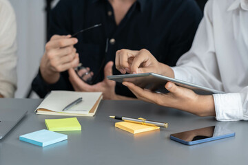 Group of diverse office worker employee take note and brainstorming on strategic business marketing planning with sticky note in office workspace. Positive and productive teamwork in workplace.Prudent