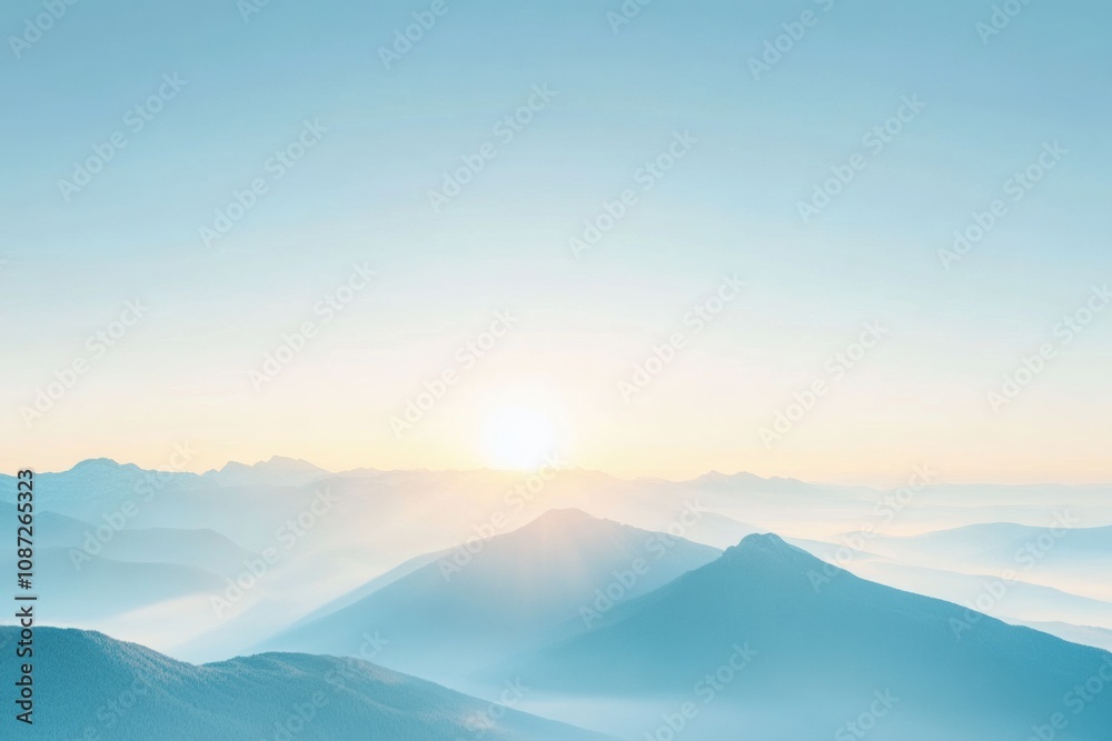 Poster the sun rises behind misty mountains, illuminating the landscape with soft light and creating a tran