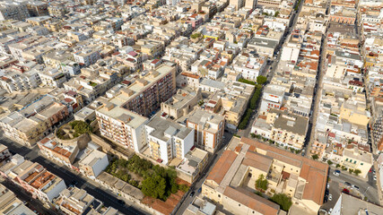 Obraz premium Aerial view of houses, buildings, apartments and roof of Manfredonia, in the province of Foggia, in Puglia, Italy.