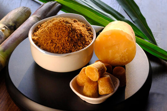 Jaggery powder with jaggery cubes. Jaggery is used as an ingredient in sweet and savoury dishes in the cuisines of India.