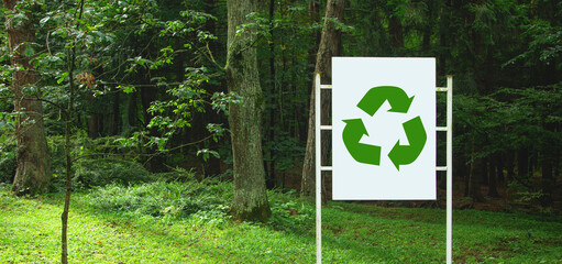 Recycle sign in nature background.