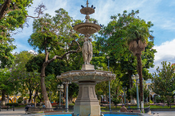 Water fountain, fountain of the three graces of the main square 14 de septiembre in Cochabamba.
