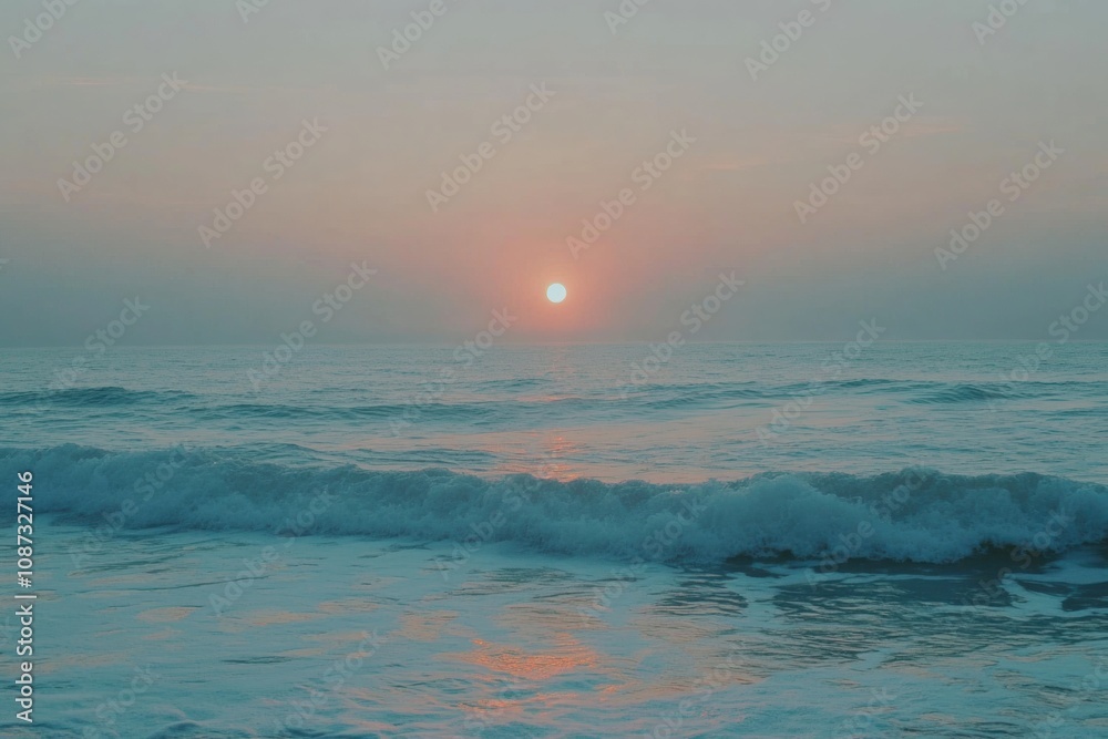 Poster the sun sets slowly over the horizon, casting warm hues across the water while waves softly lap the 