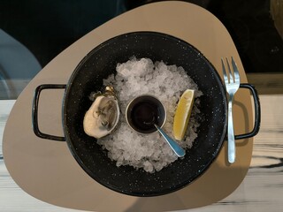 Oyster with sauce on ice