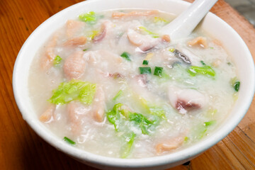 angle view fish slices and pork porridge at horizontal composition