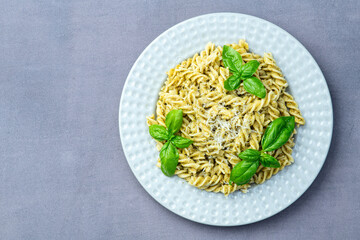 Pasta with basil sauce pesto . Italian food photography . Top view