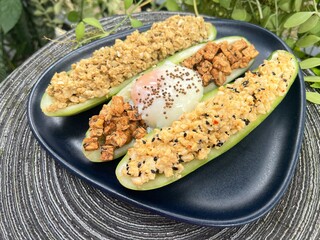 Grilled sesame mixed soy tempeh salad with soft boiled egg and cucumber