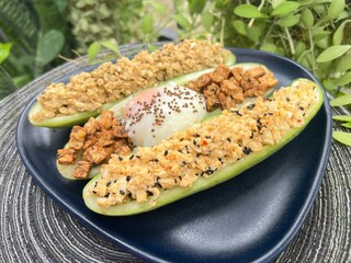 Grilled sesame mixed soy tempeh salad with soft boiled egg and cucumber