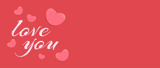 Pink heart shapes and love you text on a red background create a romantic and cheerful Valentines design,  with copy space for text.