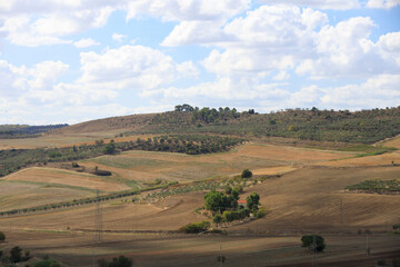 Obraz premium Road to Gravina in Puglia on a sunny summer day, province of Bari, Apulia, southern Italy.