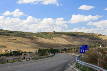 Road to Gravina in Puglia on a sunny summer day, province of Bari, Apulia, southern Italy