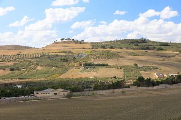Fototapeta premium Road to Gravina in Puglia on a sunny summer day, province of Bari, Apulia, southern Italy.