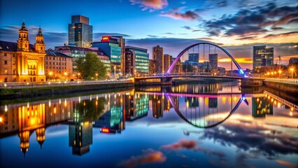 Stunning Low Light Photography of Glasgow City Skyline at Night, Showcasing Iconic Landmarks and Vibrant Reflections off the River Clyde Creating a Captivating Urban Atmosphere