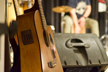 close up of musicians hands that play guitar in a theatre concert