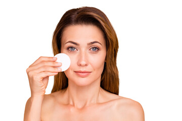 Close up photo beautiful mature she her lady morning shower bathroom take make-up down check test watch skin condition use new cotton pad nude wear no clothes isolated pastel beige background © deagreez