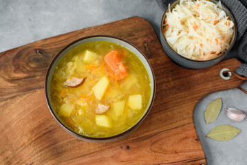 Kapusniak, traditional Polish sauerkraut soup with potatoes and carrots