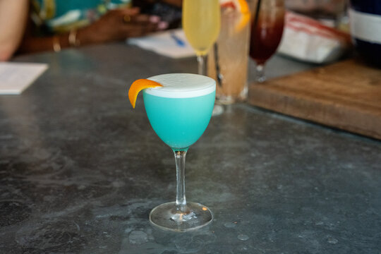 Blue cocktail on a bar 