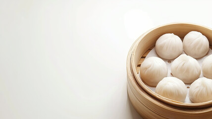 Steamed dumplings in traditional bamboo basket, perfect for sharing