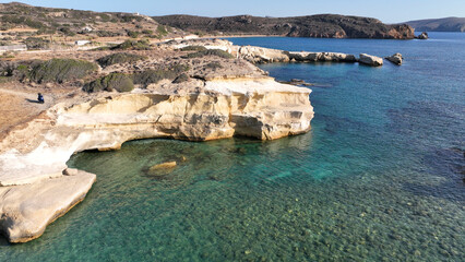 Aerial drone photo of white volcanic sea rocks in Mavrospilia, island of Kimolos, Cyclades, Greece