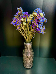 a bouquet of dry wildflowers in a vase