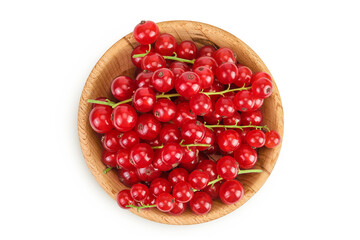 Red currant berries in a wooden bowl isolated on white background. Top view. Flat lay
